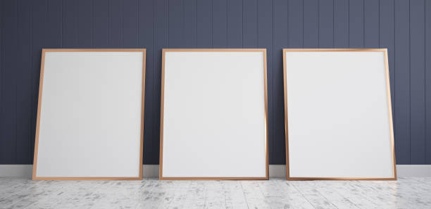istock Three Frames with Poster Mockup standing on the wooden floor 942302548