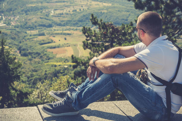 istock Man enjoying beautiful mountain landscape 942305842