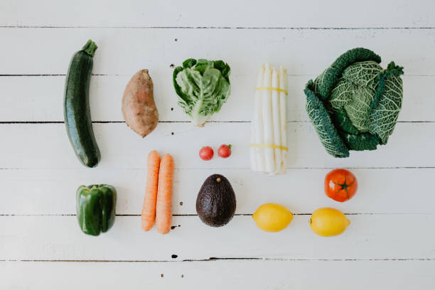 istock Assortment of vegetables on white wooden table 942314014