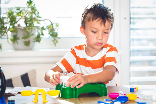 istock Portrait Of Boy Playing At Home 942314664