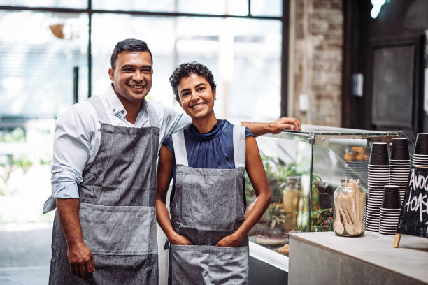 istock Cheerful multi ethnic couple working in bar 942317320