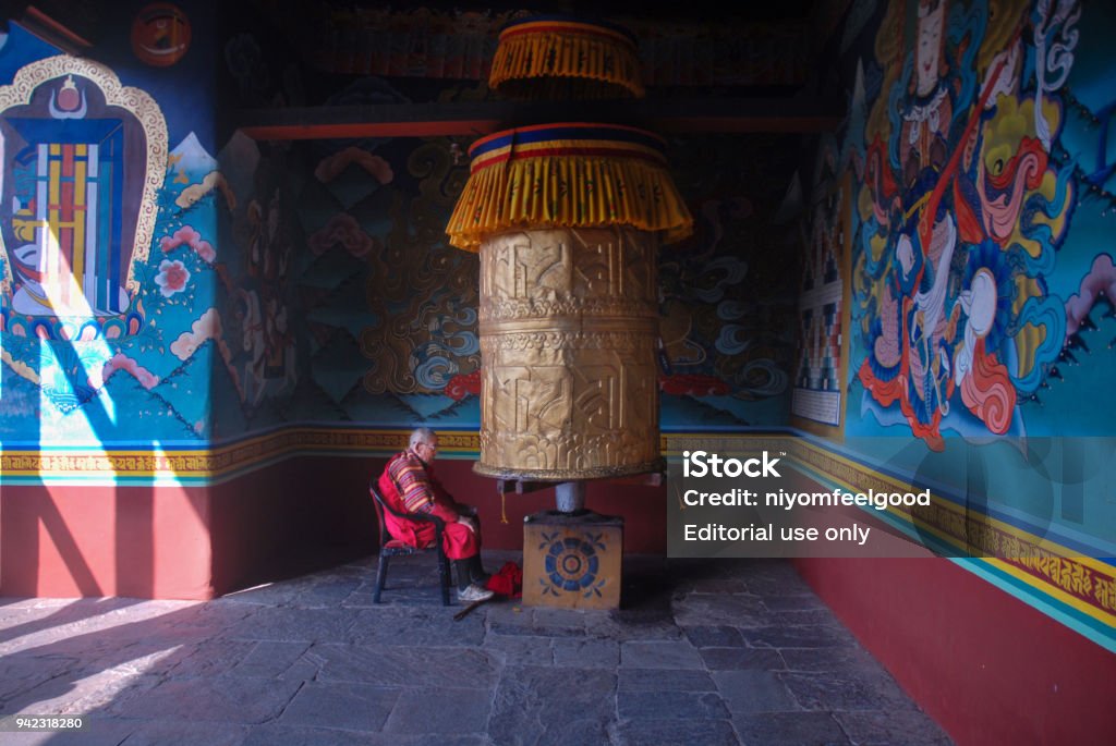 Monk at Punakha , Bhutan. 2 jun 2015,Punakha Dzong Monastery,Lama,Wall paintings and large prayer wheel, Punakha, Bhutan Ancient Stock Photo