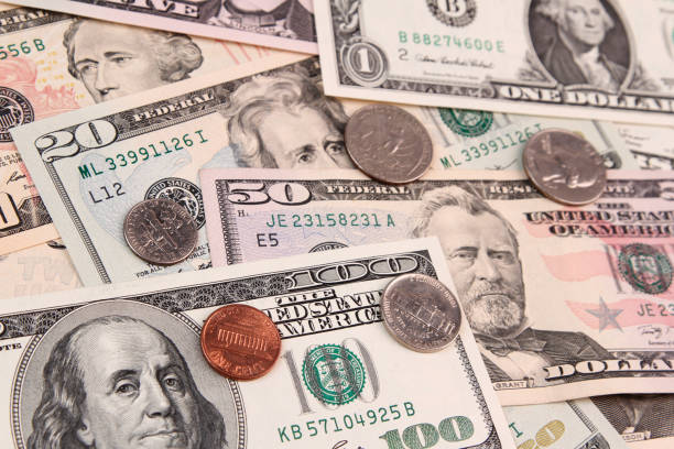 istock American coins and banknotes 942321118