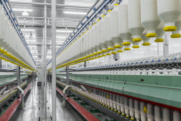 istock spools of thread at a textile factory 942321420