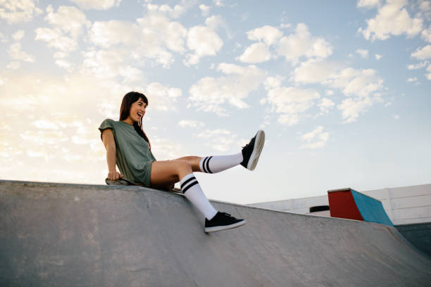 istock Woman skateboarder having fun at the skate park 942321532