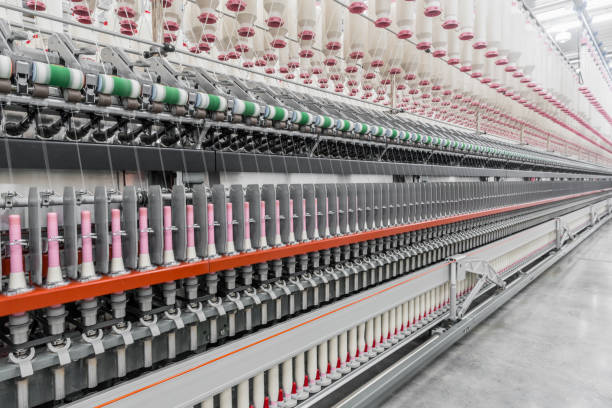 istock spools of thread at a textile factory 942325068