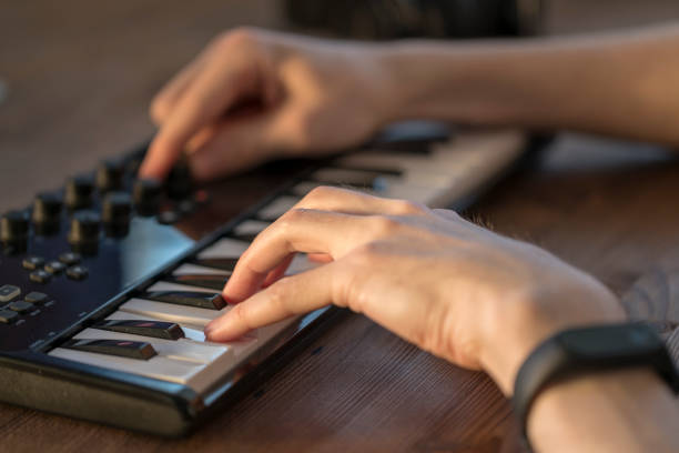 istock Musician is recording Electronic music on computer 942329672