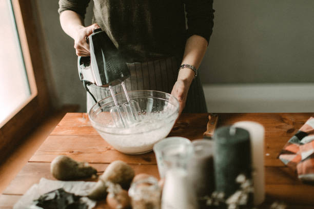 istock Young hous wife mixing wiped cream 942339828