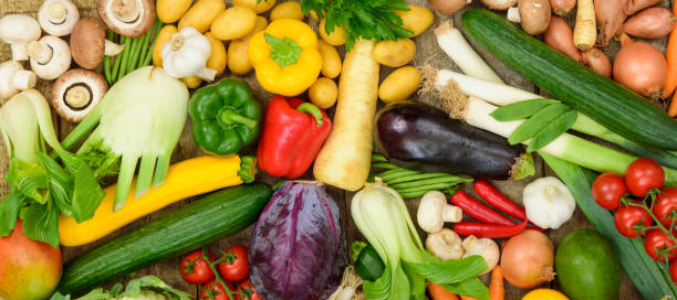 group of fresh vegetables from market - isolated on red still life tomato lemon imagens e fotografias de stock