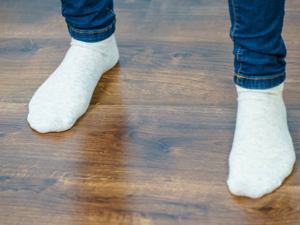 istock Unrecognizable woman wearing socks 942350706