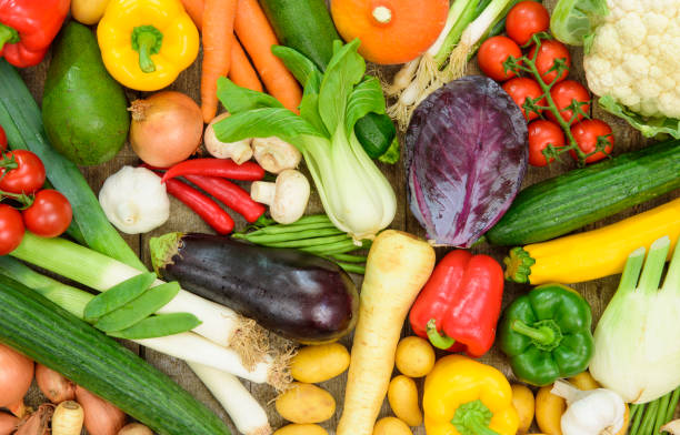 group of fresh vegetables from market - isolated on red still life tomato lemon imagens e fotografias de stock