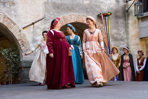 Gorizia, Italy - April 23, 2017: Medieval historical dancers on historical Court Yard in medieval clothes on historical reenactment in Gorizia, Italy.