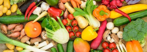 group of fresh vegetables from market - isolated on red still life tomato lemon imagens e fotografias de stock