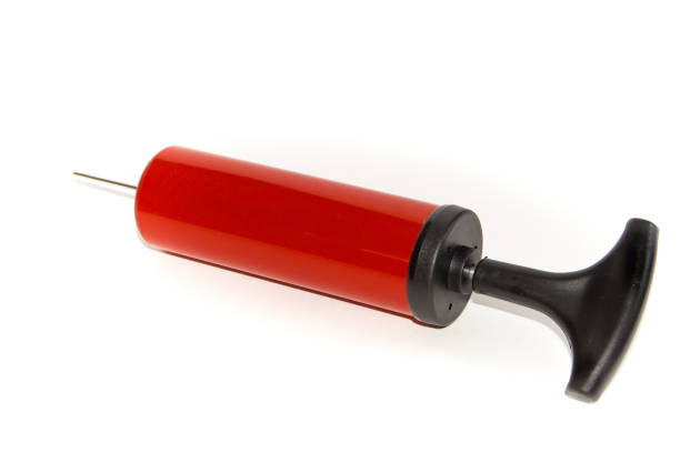 istock The pump to inflate balls on a white background. 942354760
