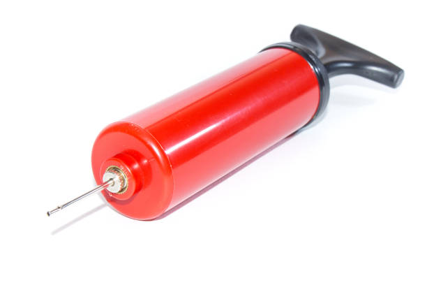 istock The pump to inflate balls on a white background. 942354866