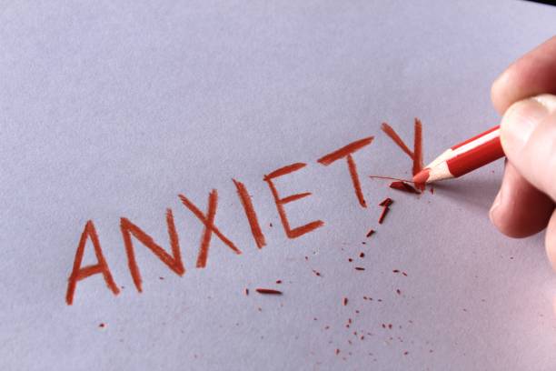 istock Anxiety concept. Word anxiety written on white paper 942360494