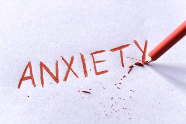 istock Anxiety concept. Word anxiety written on white paper 942360720