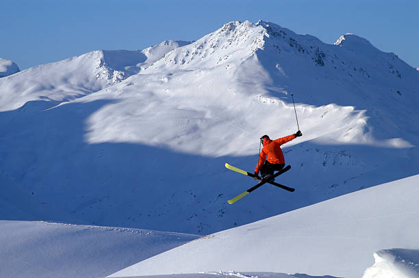 istock A skier in a red jacket performing a jump 94236110