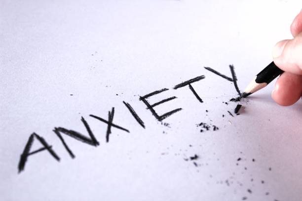 istock Anxiety concept. Word anxiety written on white paper 942361598