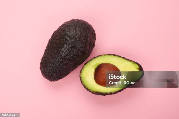 Top View Of A Ripe Sliced Avocado Isolated Stock Photo - Download Image Now - Avocado, Colored Background, Open