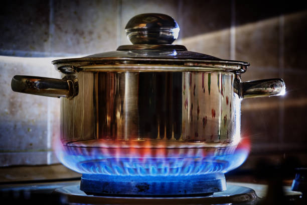 istock cooking pan is boiling on gas stove 942364624