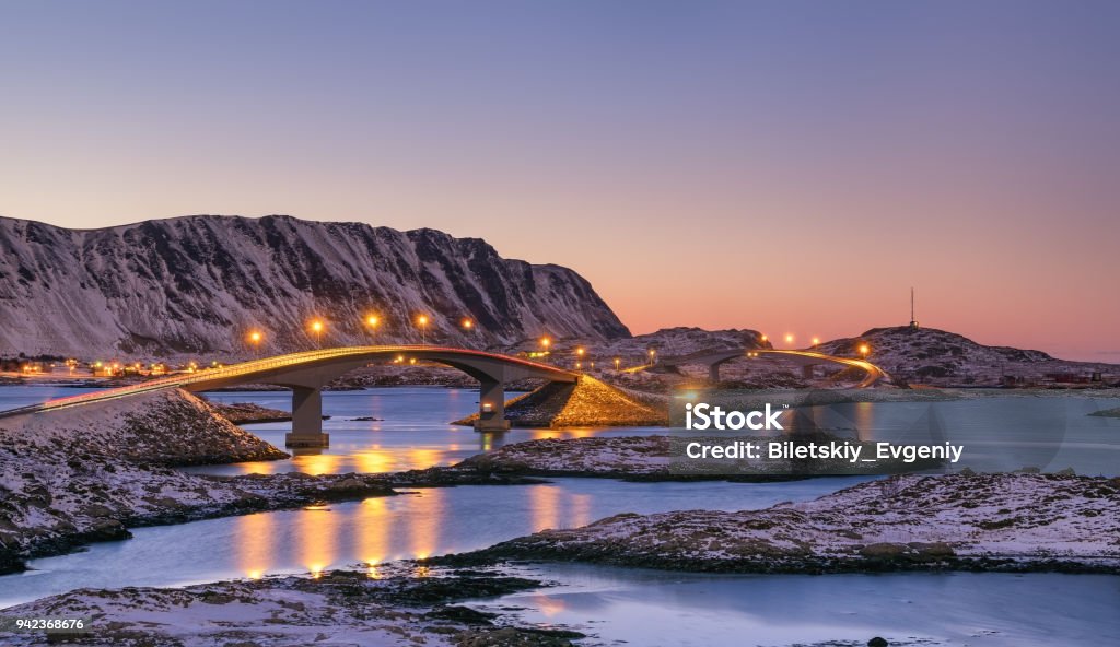 Bridge and high mountains during sunset. Natural landscape in the Norway Arch - Architectural Feature Stock Photo