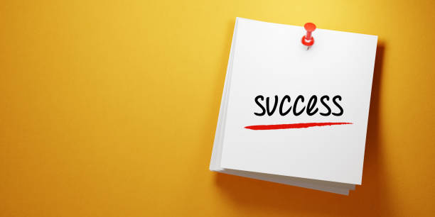 istock White Sticky Note With Success Message And Red Push Pin On Yellow Background 942369318