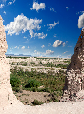 View from a breach in a wall of ancient fortress Kyzyl-kala on the Kyzylkum Desert