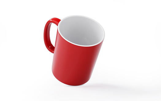 Red mug on white background. Horizontal composition with copy space. Clipping path is included.