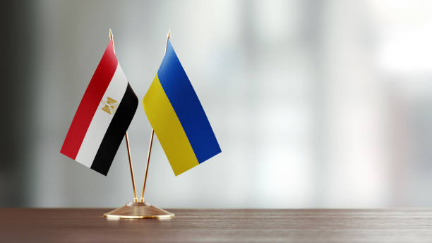 istock Egyptian And Ukrainian Flag Pair On A Desk Over Defocused Background 942384176