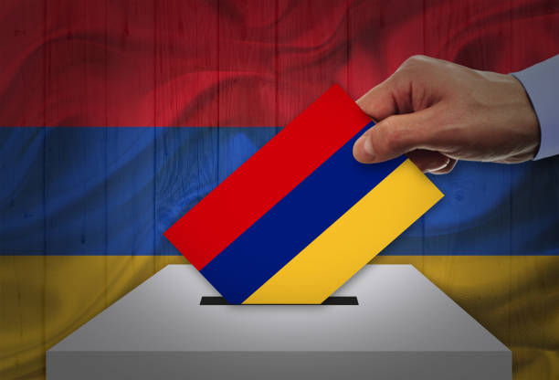 istock Man voting on elections in Armenia front of flag 942384832