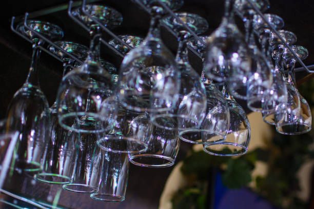 istock different cocktail glasses hanging over a bar rack 942384930