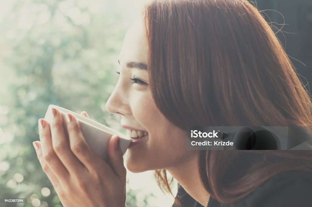 Woman drinking coffee at a coffee shop,Secretaries are happy when they drink coffee. Women Stock Photo