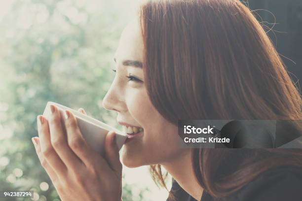 Woman Drinking Coffee At A Coffee Shopsecretaries Are Happy When They Drink Coffee Stock Photo - Download Image Now
