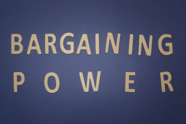 istock Bargaining Power written with wooden letters on a blue background 942394148