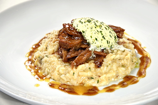 cheese risotto with filet crisps and seasoned butter