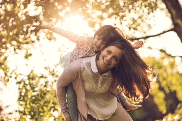 istock Mother and daughter enjoying in public park 942396904
