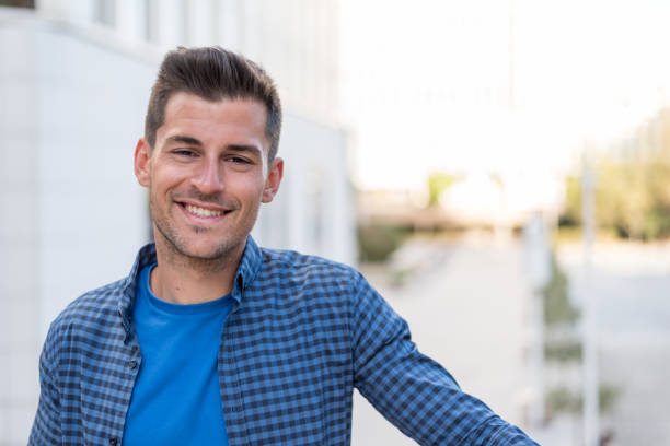 istock man close up smiling to the camera 942399460