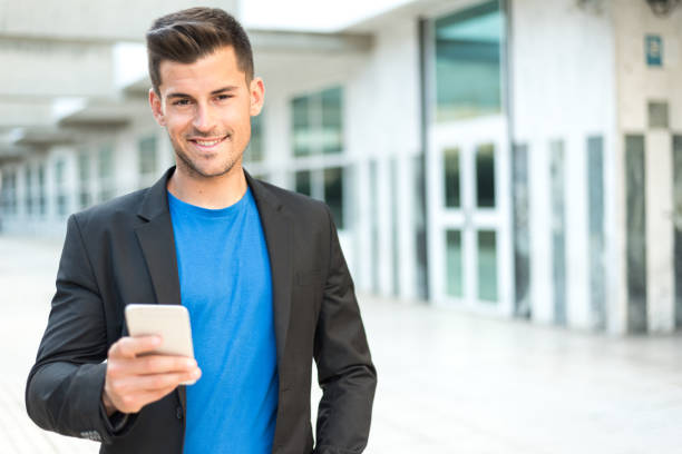 istock man close up with a mobile phone 942399970
