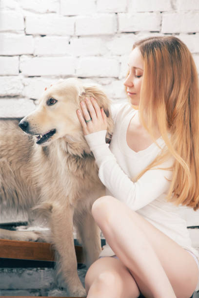istock Young woman with her dog 942400216