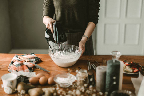 istock Young hous wife mixing wiped cream 942400940