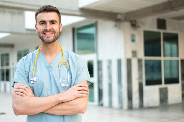 istock male nurse with stethoscope 942403292