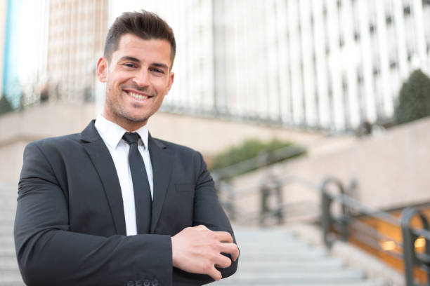 istock man crossed arms smiling businessman 942403300