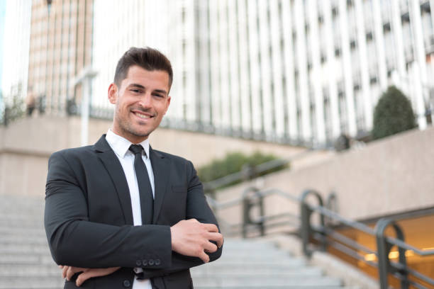 istock man crossed arms smiling businessman 942403330