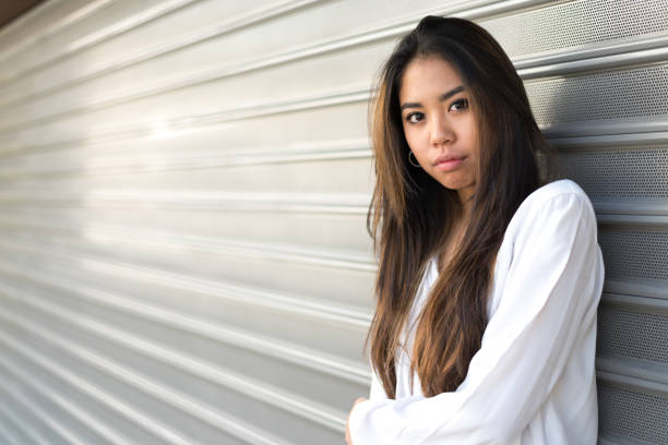 istock happy young woman smiling portrait 942404104