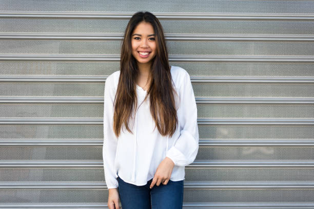 istock happy young woman smiling portrait 942406326