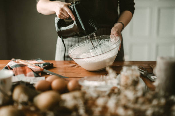 istock Young hous wife mixing wiped cream 942407346