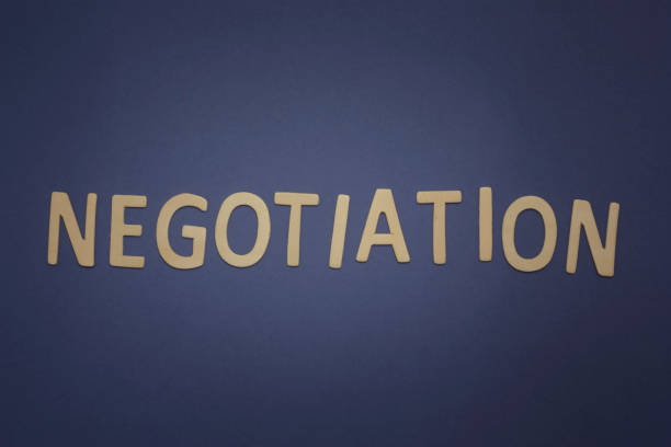 istock Negotiation written with wooden letters on a blue background 942407782
