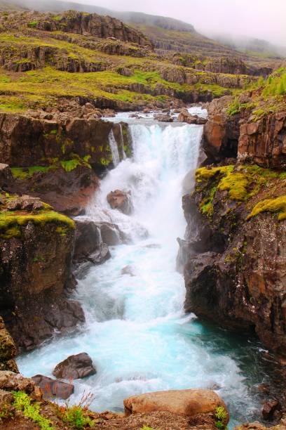 istock Sveinsstekksfoss waterfall, iceland 942410292
