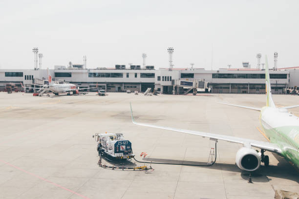 istock BANGKOK,TH -December 30:Checking the plane before flying,Aircraft maintenance in runway. on December 30,2017 in Bangkok,TH 942413080